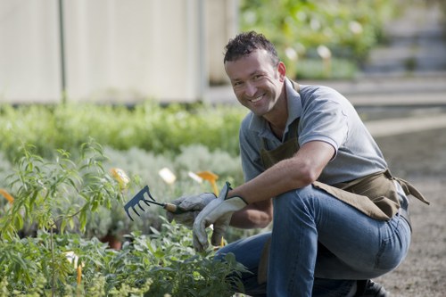 Gardening staff wearing PPE and training on equipment